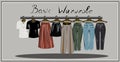 Capsule basic wardrobe for a woman. Minimalism. Fashion. Big cupboard. Wardrobe with a set of clothes on hangers and bags. Isolate